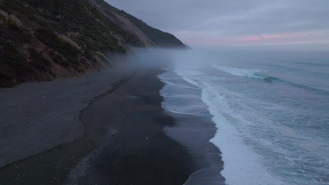 USAL Beach landscape scene Sinkyone Wilderness Lost Coast Trail California aerial drone rugged untouched coastline black sand Pacific Ocean mist sunset cloudy untouched waves crashing forward