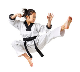 Young Asian girl in Taekwondo uniform executing a flying kick