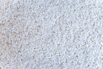 food background - short grains of uncooked white rice