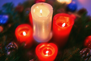 Red advent candles. Christmas decoration with christmas candles burning.