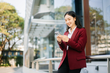 oung Asian business woman leader entrepreneur, professional manager holding digital tablet computer