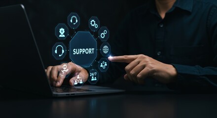 Hands on laptop with support icons, wrench.