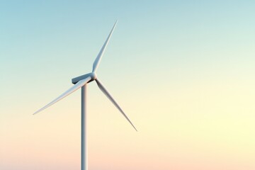 Fototapeta premium Wind turbine stands tall against soft pastel sky, symbolizing cl