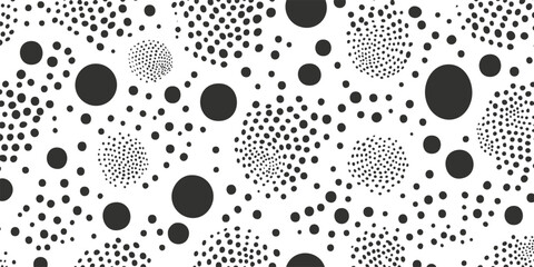 Abstract black and white dotted pattern with varying circle sizes.