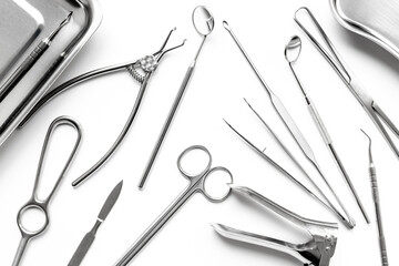 Professional medical equipment - surgery stainless metal instruments on white background. Medical hand tools