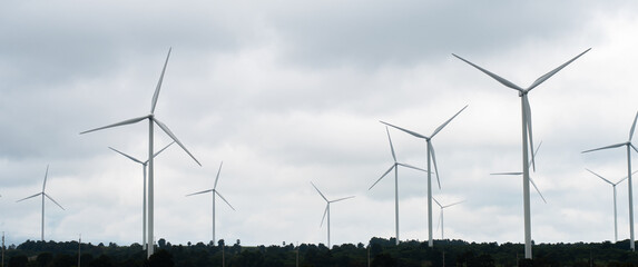 wind turbines in a cloudy sky naturally renewable energy