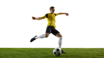 Obraz premium Low angle view of young man, soccer player in motion during game, training, powerfully kicking ball with extended leg against white background. Concept of sport, competition, action.
