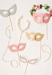 Wedding photo booth props featuring playful accessories on lace table, celebration