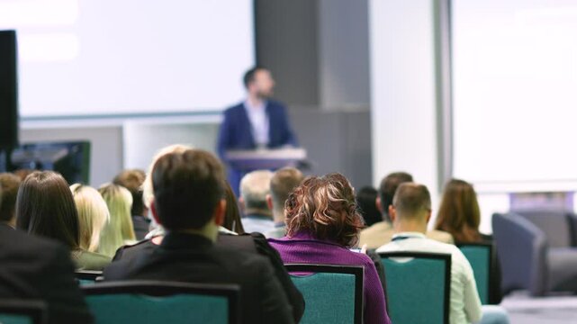 Business conference, corporate presentation or life coaching training, blurred public speaker in the background
