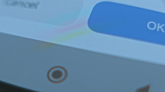 Finger taping Uninstall option on smartphone