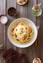 Pasta bucatini carbonara with cheese and pancetta. Italian food.