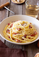 Pasta bucatini carbonara with cheese and pancetta. Italian food.