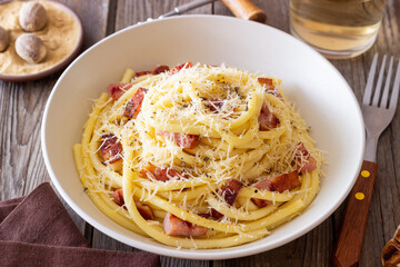 Pasta bucatini carbonara with cheese and pancetta. Italian food.