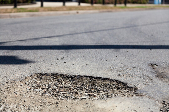 Pot hole in sealed road