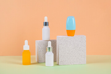 Plastic white tube for cream or lotion. Skin care or sunscreen cosmetic with stylish props on cream...