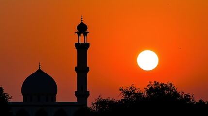 Beautiful Twilight Silhouette of a Mosque Against a Vibrant Sunset Sky with Large Setting Sun