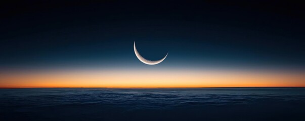 Dark sky concept. A serene twilight scene featuring a crescent moon above a calm horizon.