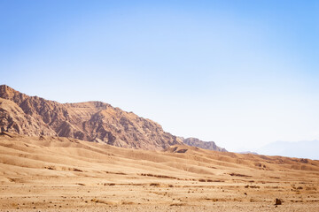 Rugged, arid landscape in eastern Iran, the Middle East. Mountains and vast plains.