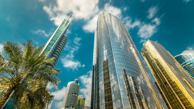 Look up panoramic and perspective view to steel glass high rise building skyscrapers timelapse hyperlapse, Dubai, UAE