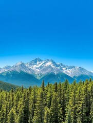 Fototapeta premium Majestic Mountains and Evergreen Forest - Serene landscape of snow-capped mountains rising above a lush evergreen forest under a vibrant blue sky. Symbolizes nature, peace, tranquility, adventure