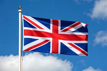 The United Kingdom&rsquo;s Union Jack flag waving against a blue sky, representing British heritage, unity, patriotism, and national pride.