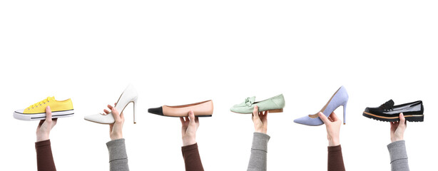 Obraz premium People holding different shoes in hands on white background, closeup