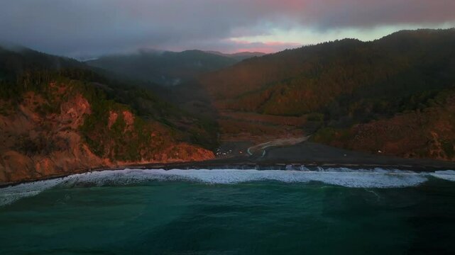 Northern California vast camping USAL Beach Campground waves crashing bluffs cliffside mountain rocky rugged remote coast aerial drone vibrant sunset Sinkyone Wilderness surf swell black sand forward