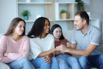 Man and woman flirting and friends refusing it