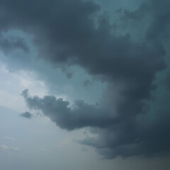 Dramatic storm clouds gathering, dark ominous clouds swirling in the sky, evoking a sense of impending weather change.