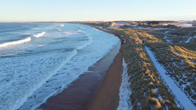 Flight over coast covered by snow, Fraserburgh, Scotland 