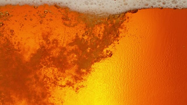 Super Slow Motion Shot of Beer Bubbles and Fresh Foam Background at 1000fps.