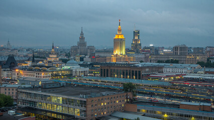 Fototapeta premium Evening top view of three railway stations day to night timelapse at the Komsomolskaya square in Moscow, Russia