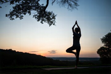 Woman Doing Yoga at Sunset