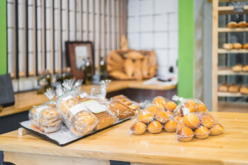 Delicious freshly baked cookies and muffins waiting on bakery counter