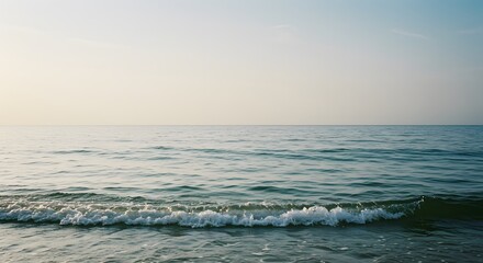 Calm Ocean Waves at Sunrise - Beautiful Seascape with Horizon over the Water