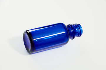 Blue glass jar without logos for mockups of medicines, vitamins, cosmetics