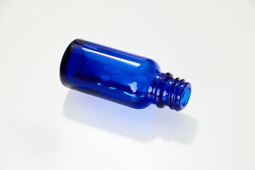Blue glass jar without logos for mockups of medicines, vitamins, cosmetics