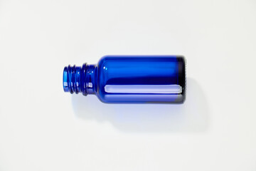 Blue glass jar without logos for mockups of medicines, vitamins, cosmetics