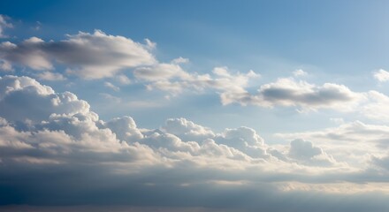 Obraz premium Serene Skies, A Mesmerizing Display of Clouds Against a Pale Blue Sky