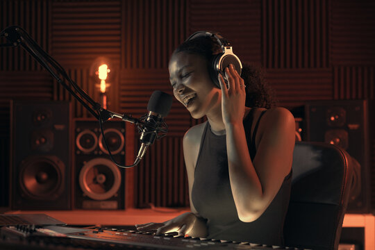 Artist recording a song in the studio