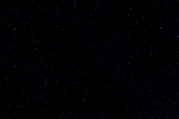 Starry night sky. Galaxy space. Glowing stars. Falling stars in the loop.