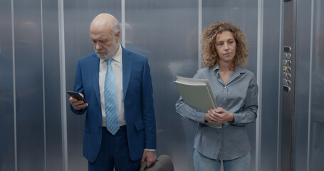 Workers standing in the elevator