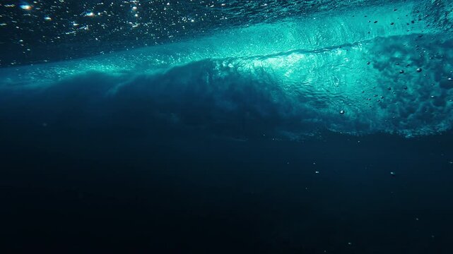 Ocean wave breaks as seen from underwater