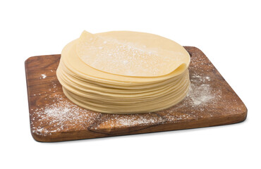 Stack of slices of dough on wooden board. Dough isolated.