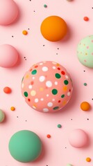 Pastel colored spheres and small dots on a pink background. A variety of sphere sizes and patterns create a playful, vibrant composition.