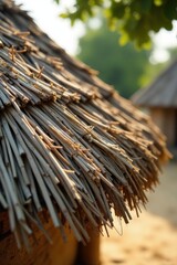 Close-up View of a Rustic Thatched Roof Under Warm Sunlight, Showing the Intricate Detail and Texture of the Natural Material