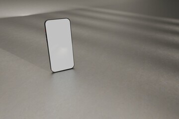 Mockup smartphone on grey studio floor. Hit by sunlight. Use as template for UX designs, websites, ads, and more