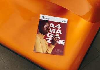 Mockup Of Closed Customizable A4 Magazine On Orange Seat