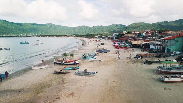 People celebrate the day of Iemanja, or the day of Our Lady of Navigators. Group of people gather on the beach in Brazil and celebrate. Iemanja is a popular Afro-Brazilian deity associated with the