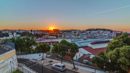 Obraz premium Sunrise over Lisbon aerial cityscape skyline timelapse from viewpoint of St. Peter of Alcantara, Portugal.